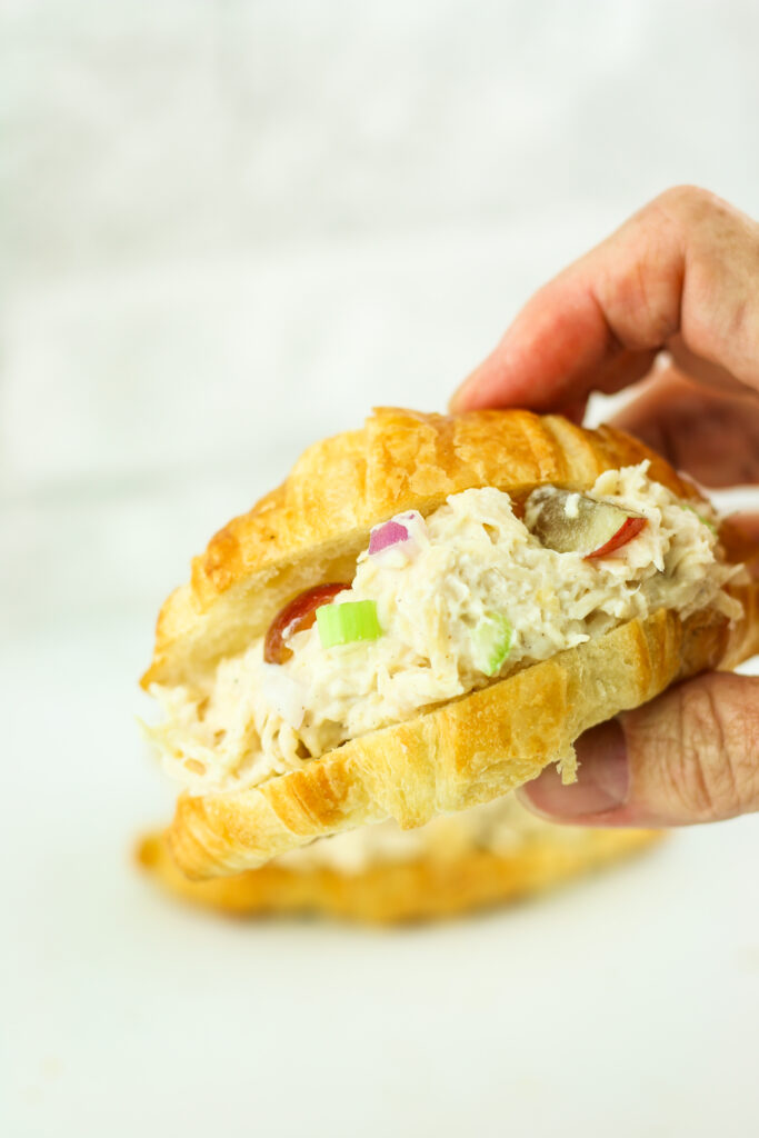 Cottage cheese chicken salad on a croissant.