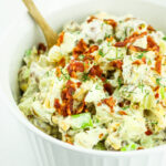 A bowl of loaded cottage cheese potato salad