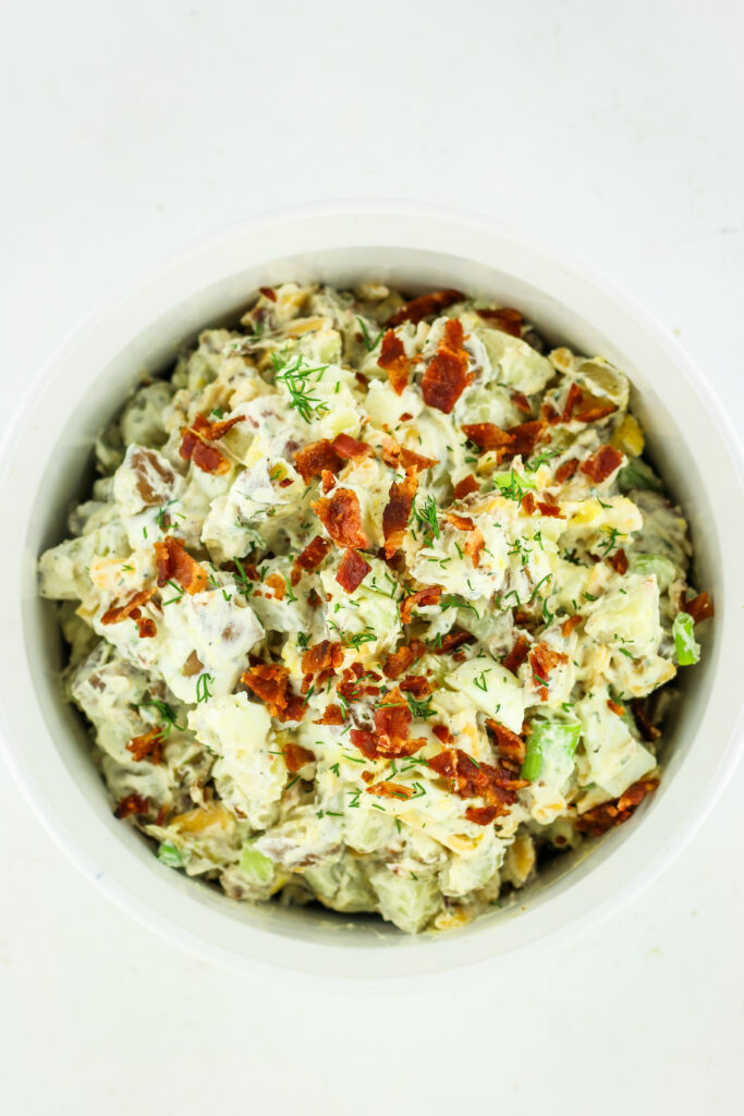 A bowl of loaded cottage cheese potato salad