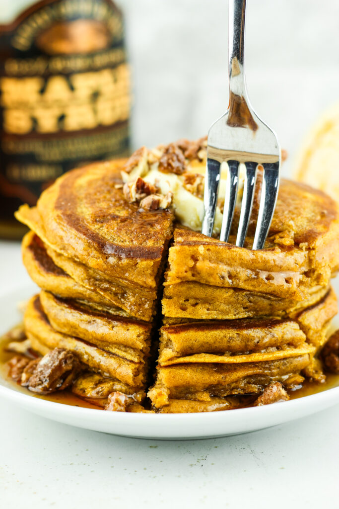 Stack of fluffy pumpkin cottage cheese pancakes.