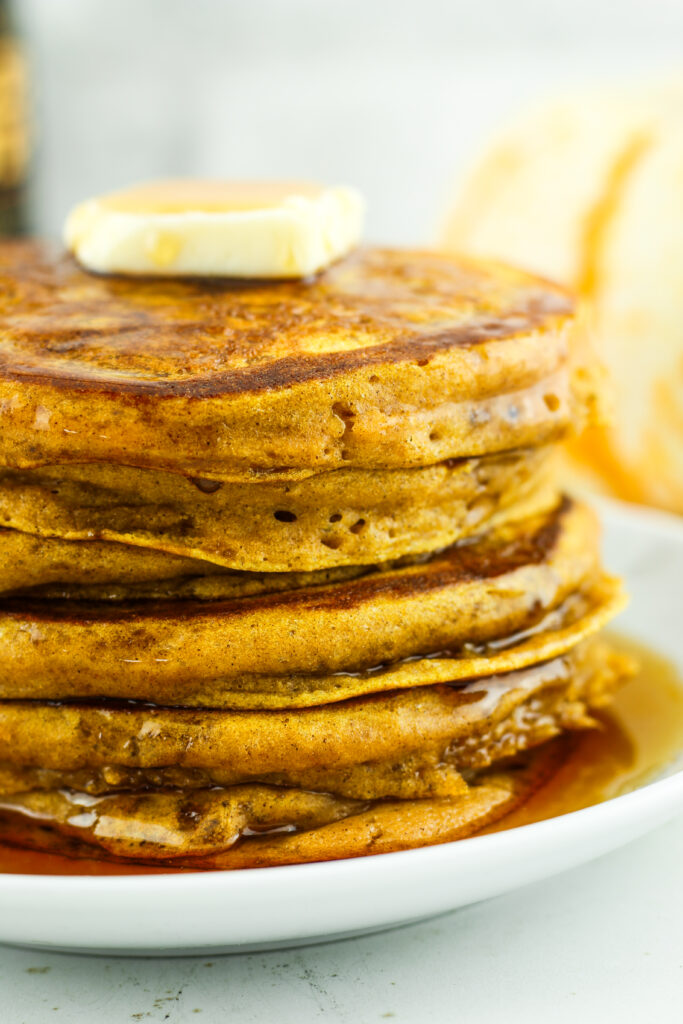 Stack of fluffy pumpkin cottage cheese pancakes.