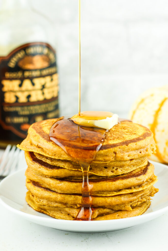 Stack of fluffy pumpkin cottage cheese pancakes.